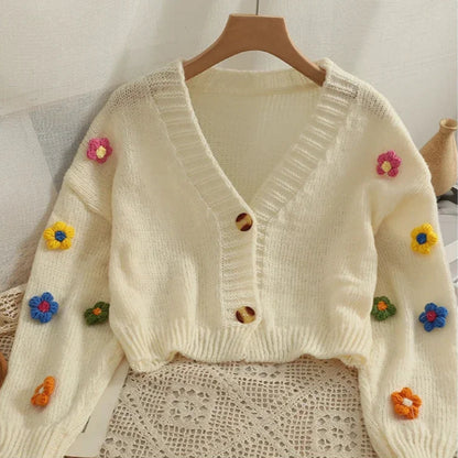 Cardigan tricoté avec fleurs colorées